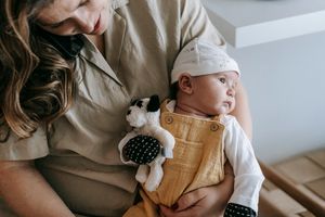 Friend helping with new born baby